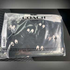 Coach Disney Eye zip wristlet